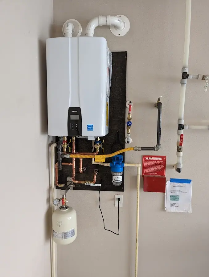 Professional plumber installing copper piping in a Pen Argyl home